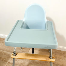Load image into Gallery viewer, a sage silicone high chair table cover on a white ikea highchair
