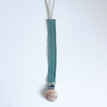 Load image into Gallery viewer, cotton dummy clip in pine colour with a elephant logo on the wooden clip
