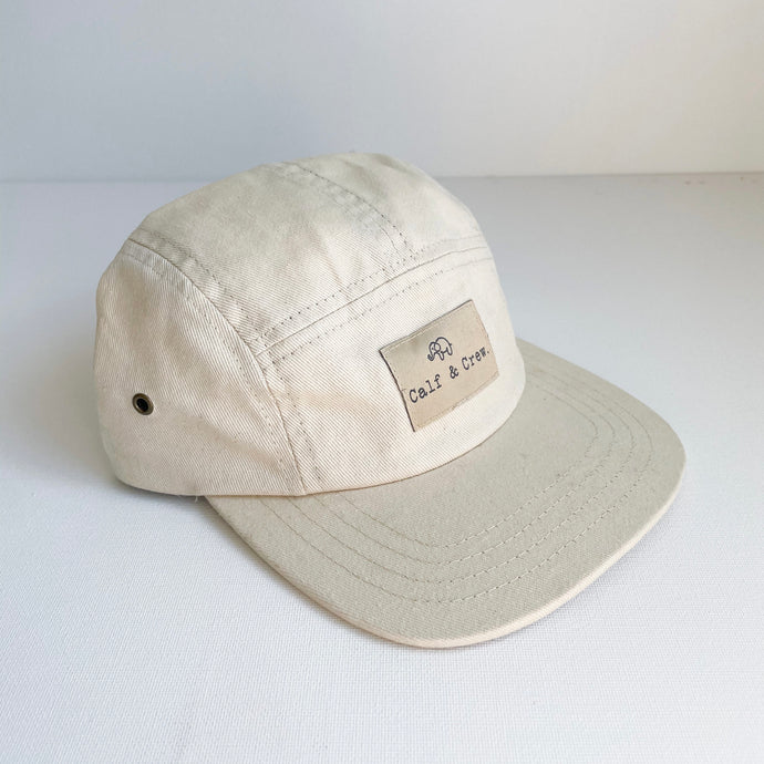 crew cap in cream with a Calf & Crew logo patch on the front