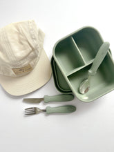 Load image into Gallery viewer, the crew cap in cream with an open silicone bento lunchbox in sage and stainless steel spoon, fork, and knife in sage colour
