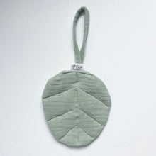 Load image into Gallery viewer, linen leaf dummy holder in sage colour showing elephant logo tag
