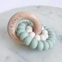 Load image into Gallery viewer, wooden ring with calf &amp; crew logo around a double silicone ring in mint colour
