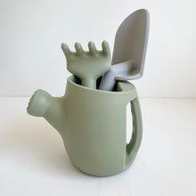 Load image into Gallery viewer, Thyme silicone garden set with a green rake and grey spade inside a green watering can

