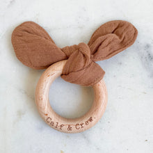 Load image into Gallery viewer, Terracotta muslin bunny ear teether ring engraved with Calf &amp; Crew logo
