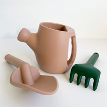 Load image into Gallery viewer, Peony silicone garden set with a peach spade and watering can and a green rake
