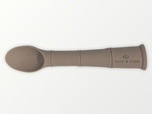 Load image into Gallery viewer, a my first baby spoon in latte silicone with the calf &amp; crew logo
