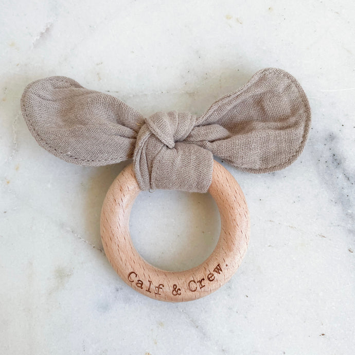Taupe muslin bunny ear teether ring engraved with Calf & Crew logo
