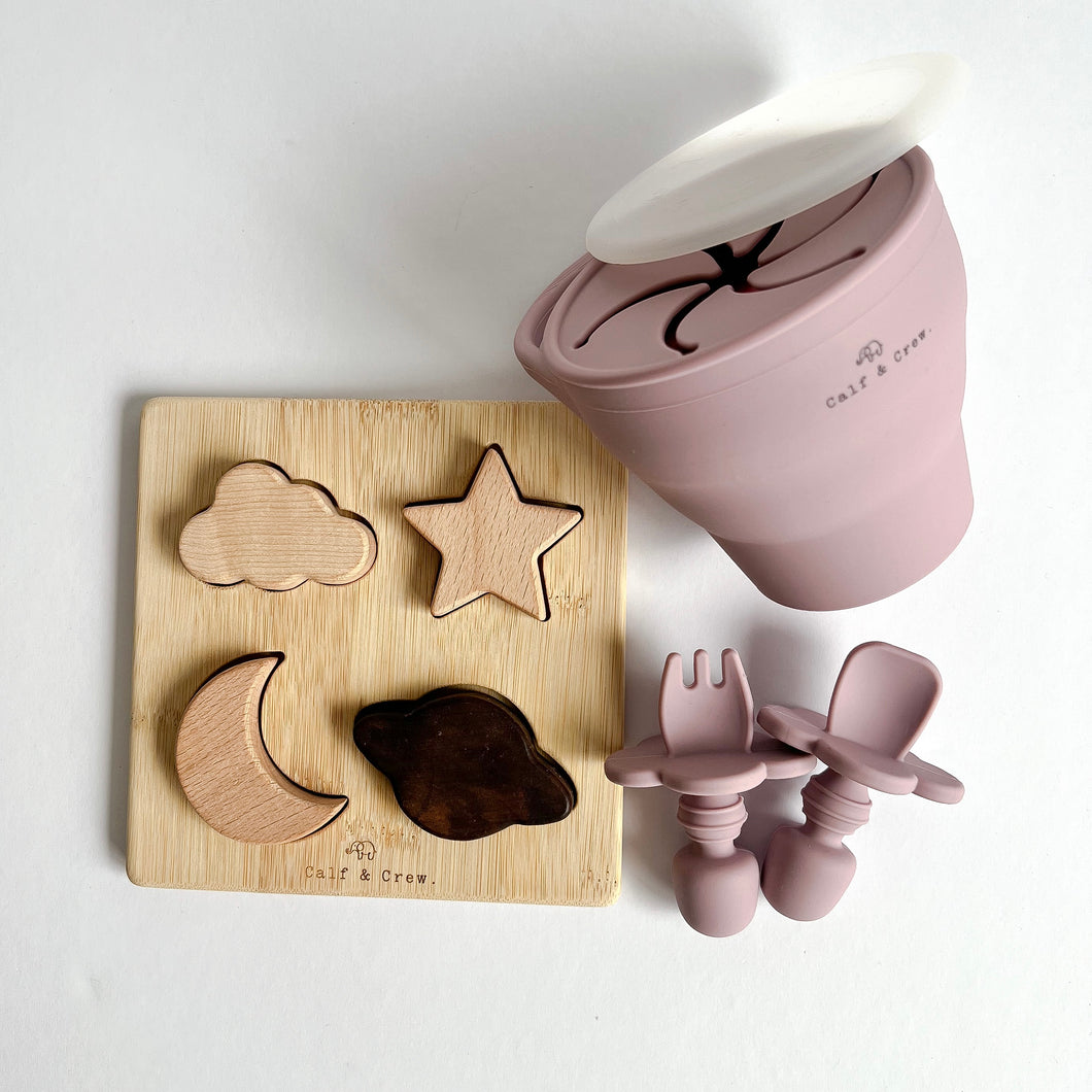 the wooden night sky puzzle with the collapsible snack cup and easy grip spoon and fork in rose colour