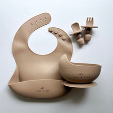 Load image into Gallery viewer, Silicone bib, silicone suction bowl, and easy grip spoon and fork in latte colour 
