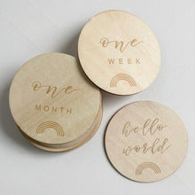 Load image into Gallery viewer, three wooden discs with milestones and a rainbow engraved on them
