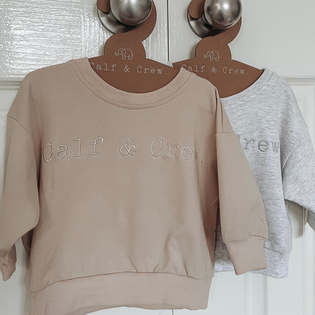 crew sweatshirts hanging on calf & crew hangers in blizzard and eggnog colour