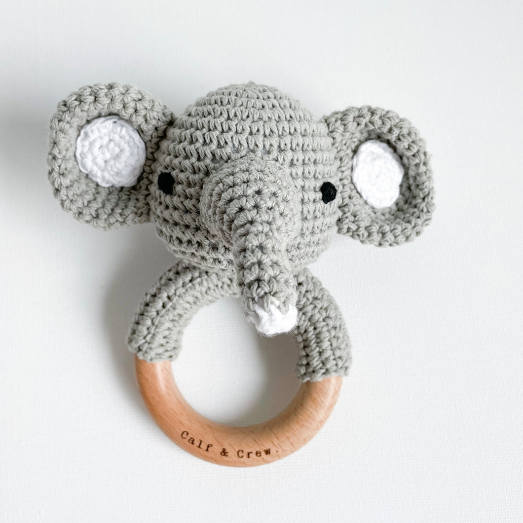 grey crochet elephant rattle on a wooden ring