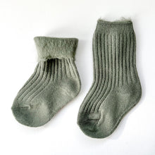 Load image into Gallery viewer, a pair of crew cosy socks in khaki with one folded to show fluffy inside
