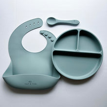 Load image into Gallery viewer, a silicone bib, suction divider plate and a silicone spoon in baby blue colour
