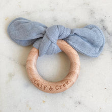 Load image into Gallery viewer, Blue muslin bunny ear teether ring engraved with Calf &amp; Crew logo
