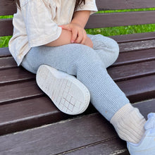 Load image into Gallery viewer, a child sitting on a park bench wearing the ribbed thick slim fit leggings in cloudy grey
